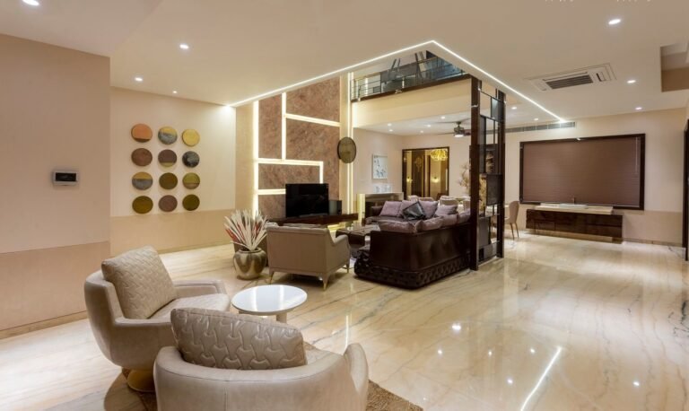 Modern living room interior with plush sofas, ambient lighting, and a glossy marble floor.