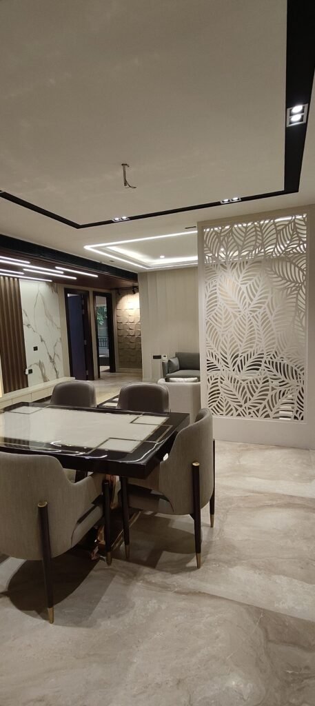 Modern office space with a large dining table and stylish chairs, thoughtfully designed by an interior designer for collaborative meetings and dining.